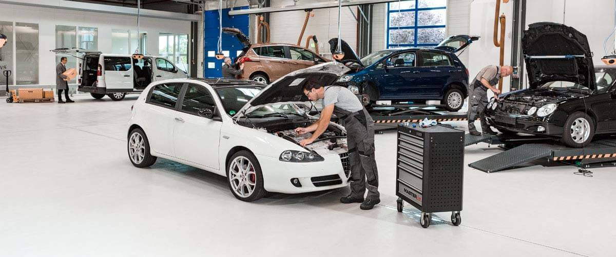 Mechanic is checking Alfa Romea 147 car in mechanics shop – German Car Depot Mechanic is checking Alfa Romeo 147 car in mechanics shop