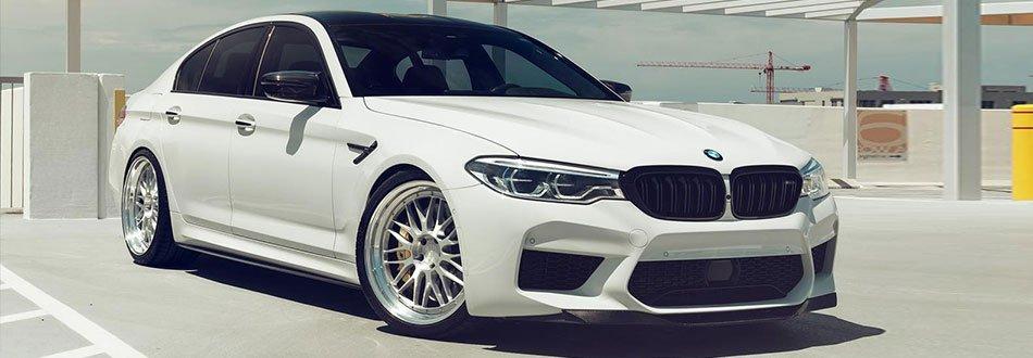 A white BMW M5 car