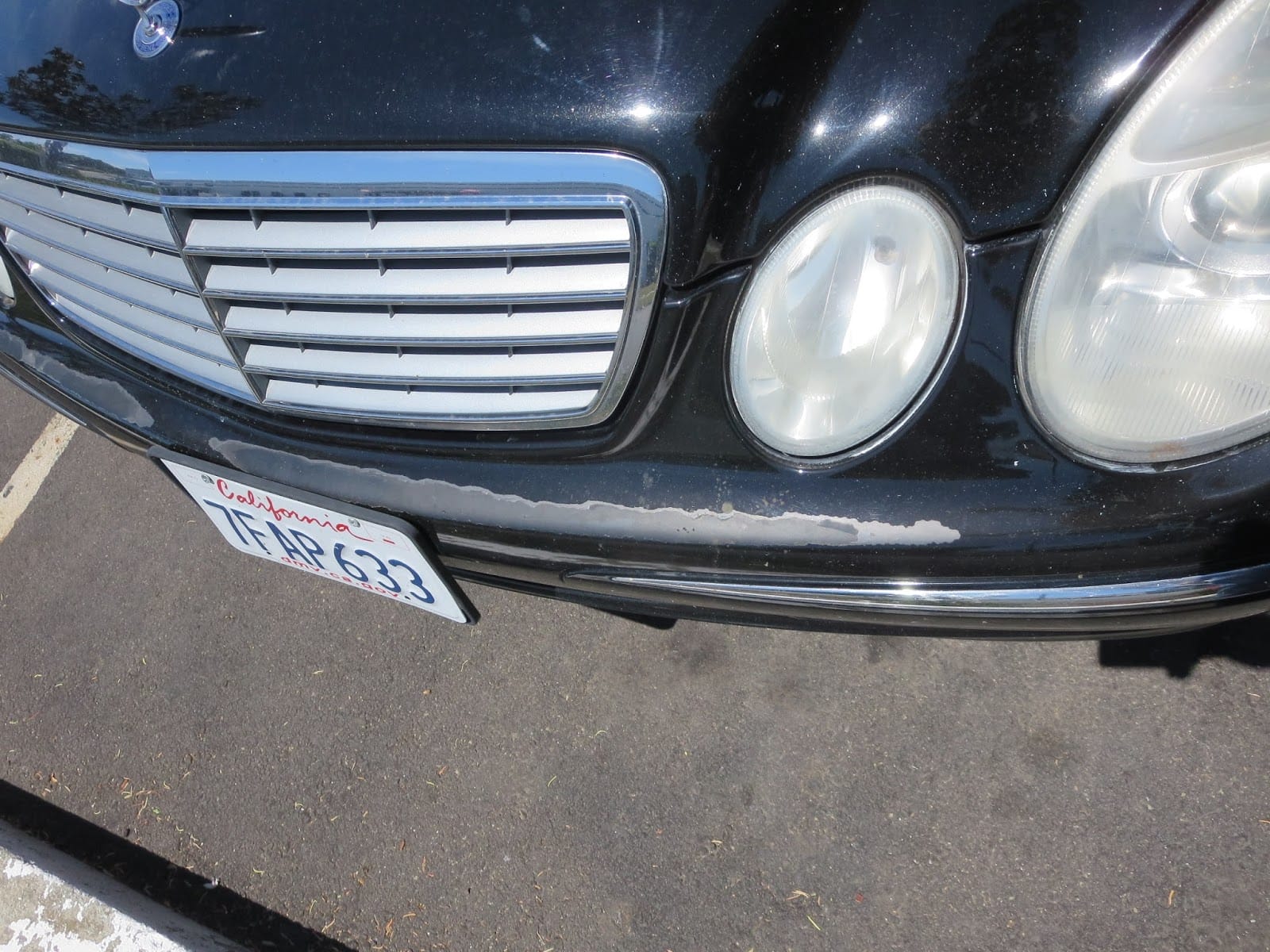A Mercedes Benz car with front left headlight