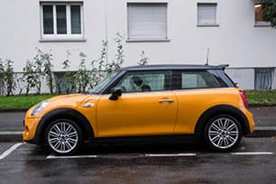 A yellow MINI Cooper car